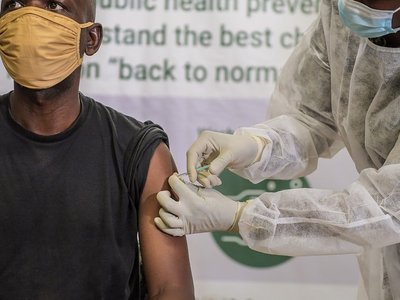 A Ugandan soldier serving under the African Union Mission in Somalia (AMISOM) takes the COVID-19 jab at the launch of the COVID-19 vaccination campaign in Mogadishu, Somalia on 17 May 2021. 