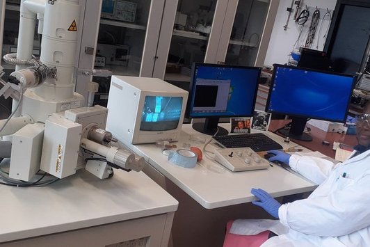 Mrs. Funke Oshin investigating the morphology of the photoanode of a dye-sensitized  solar cell using a Scanning Electron Microscope