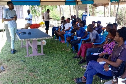 Maseno university staff Mr. Nicholas Outa, training the youth and women on BSF production and feed formulation technique in Kisumu, Kenya