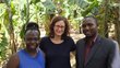 Two APPEAR scholars and one APPEAR representative posing for a photo in front of banana plants