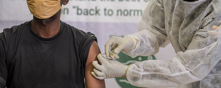 A Ugandan soldier serving under the African Union Mission in Somalia (AMISOM) takes the COVID-19 jab at the launch of the COVID-19 vaccination campaign in Mogadishu, Somalia on 17 May 2021. 