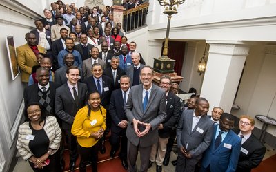 big group of people posing for a picture in the ministry